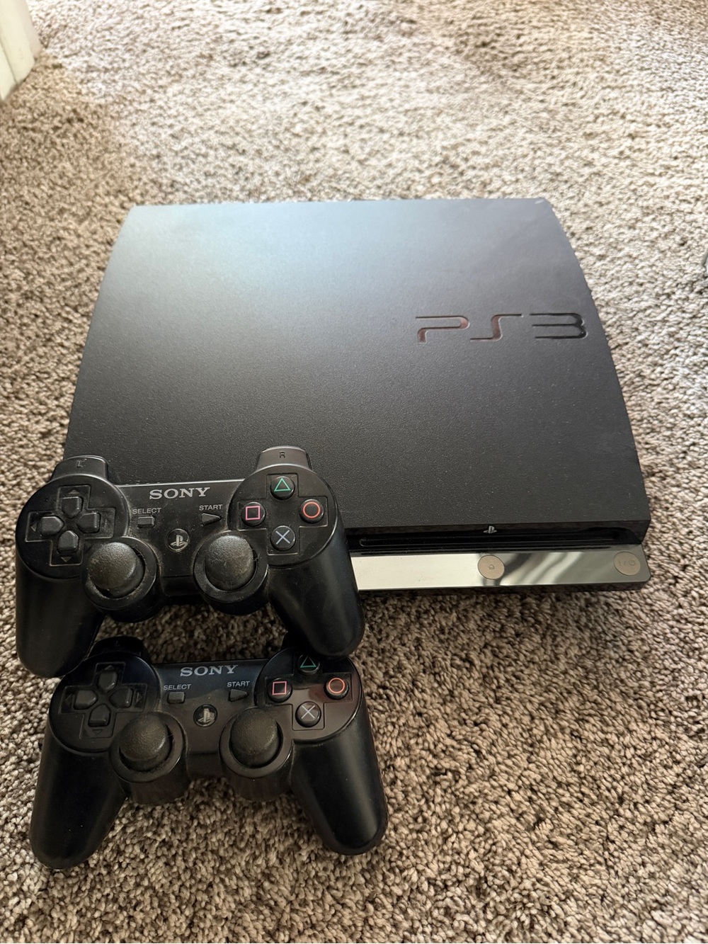 Sony PS3 Slim Console with Two Black Wireless Controllers